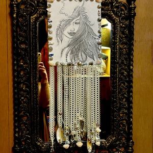 It is a picture of a boho Goddess that I drew on canvas.